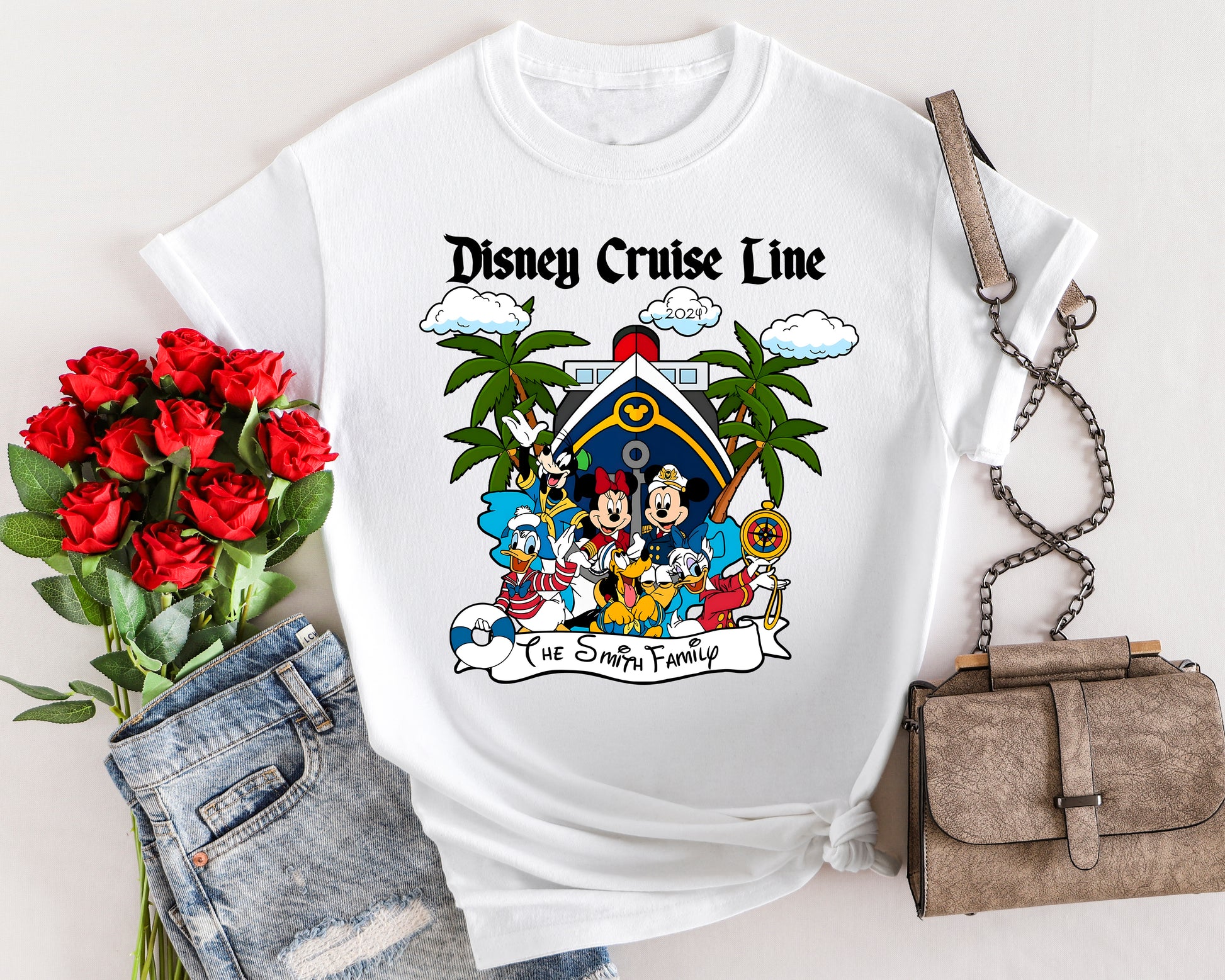 White t-shirt with Disney Cruise Line graphic featuring cartoon characters, surrounded by a bouquet of red roses and a handbag.