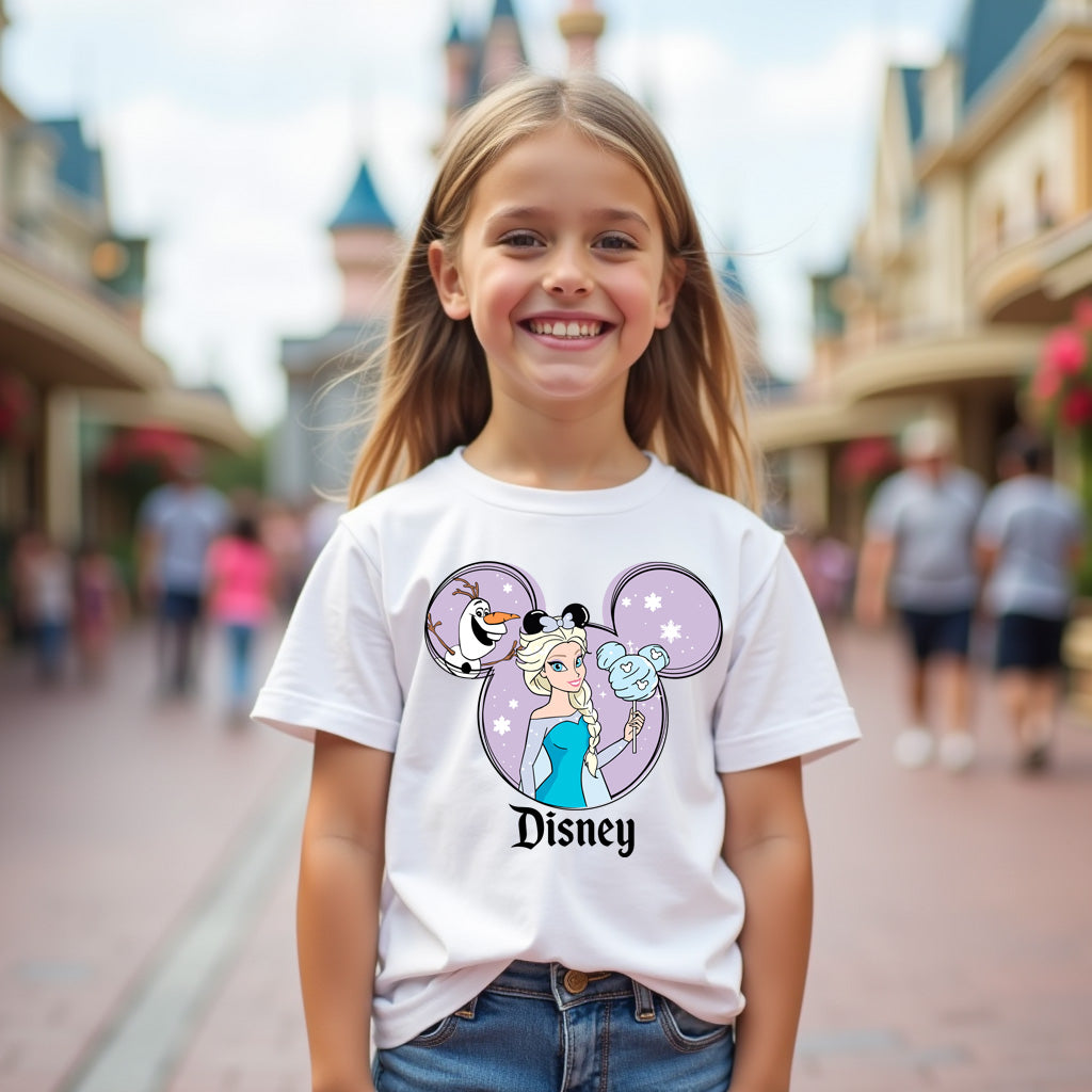 Young girl wearing a Disney t-shirt with a castle in the background