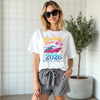 Woman wearing a 'Family Cruise 2026' t-shirt with a cruise ship graphic.