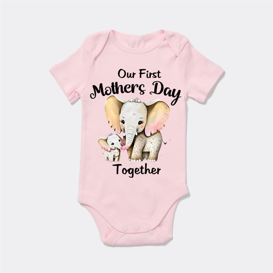 Pink baby onesie with elephant design and text on a white background