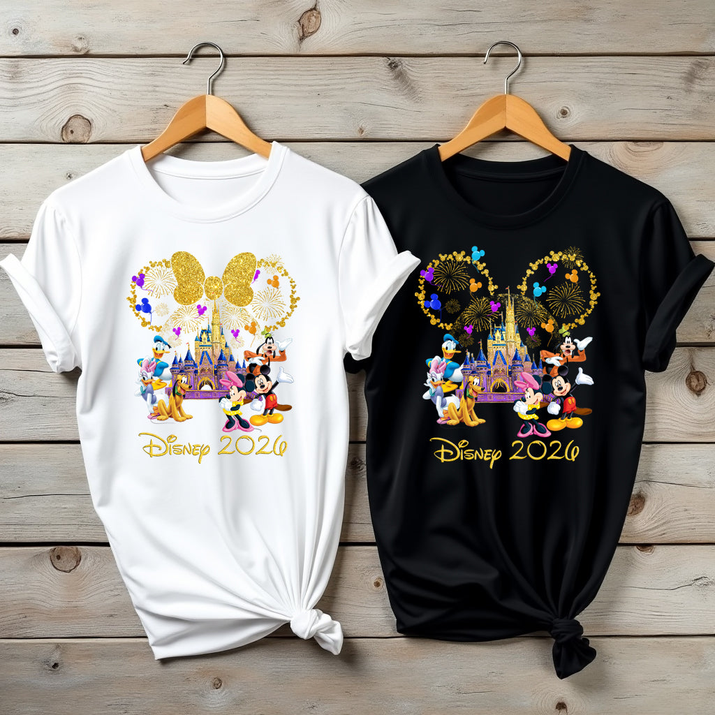 Two t-shirts with Disney-themed designs on wooden hangers.