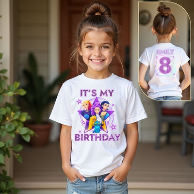 Young girl wearing a kpop white t-shirt with 'It's My Birthday' and character graphics, with a close-up inset of the back text.