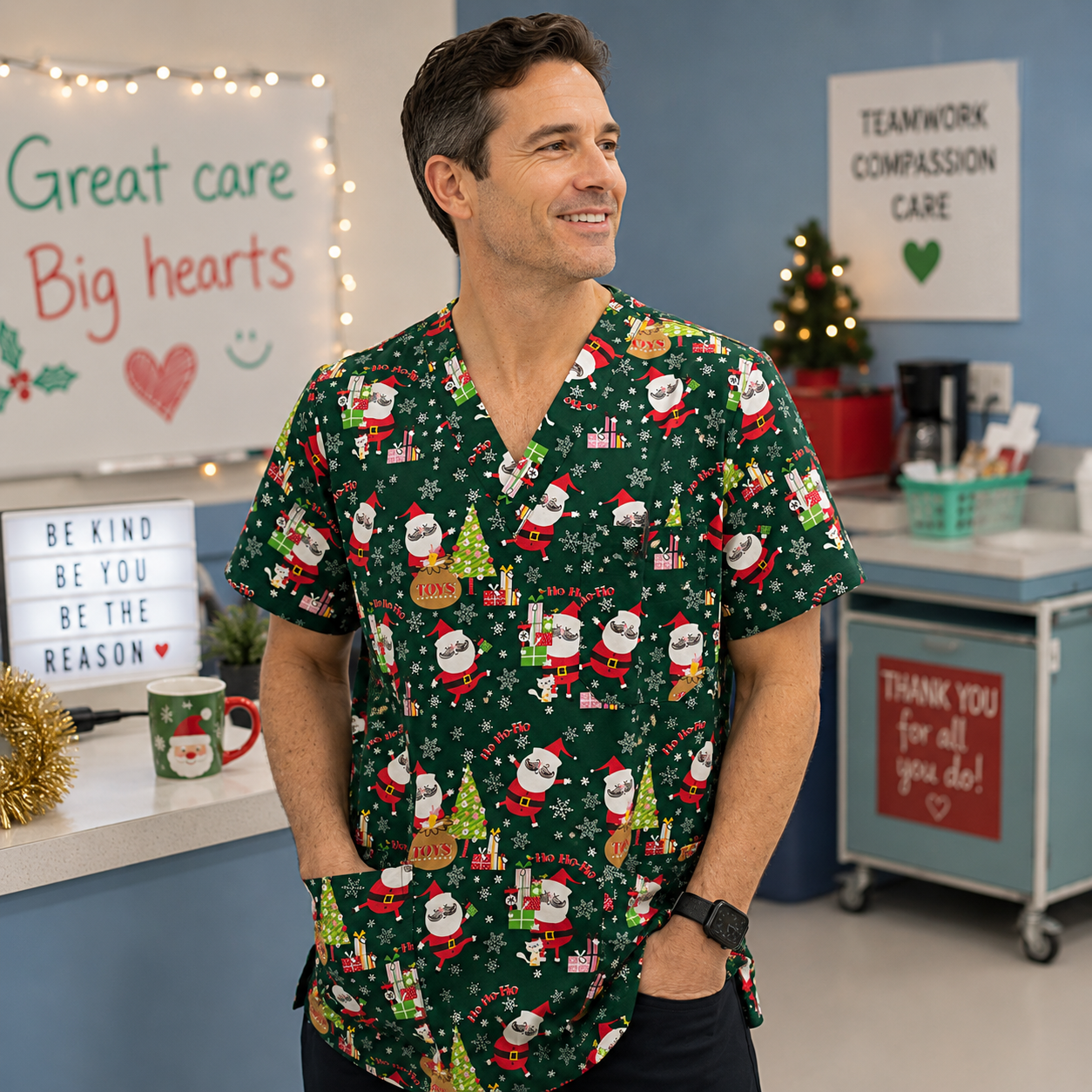 Man wearing a festive green scrub top with Santa Claus design in a medical setting.