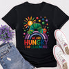 Flat lay of “Hungry for Learning” t-shirt featuring colourful caterpillar design inspired by classic children’s book.