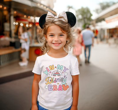 Front view of Rainbow Castle Era Disney Inspired T-Shirt showing vibrant castle design on soft cotton fabric