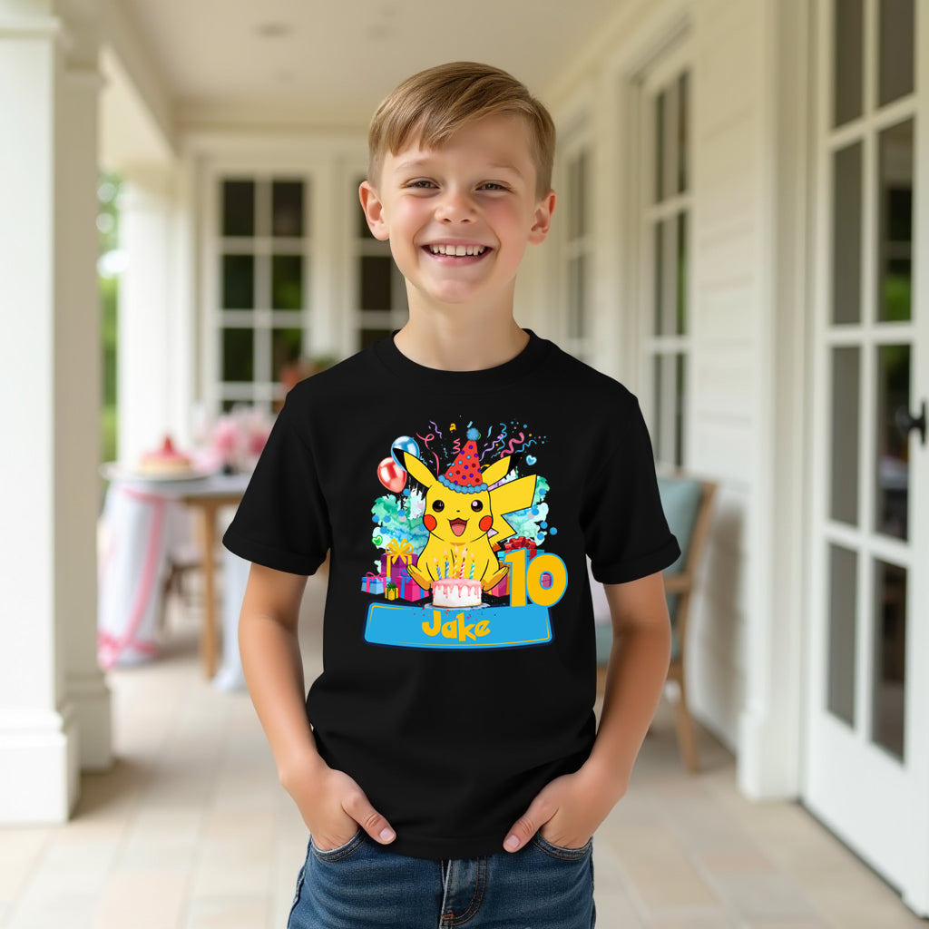 Child wearing a black t-shirt with a colorful Pikachu design on a porch.