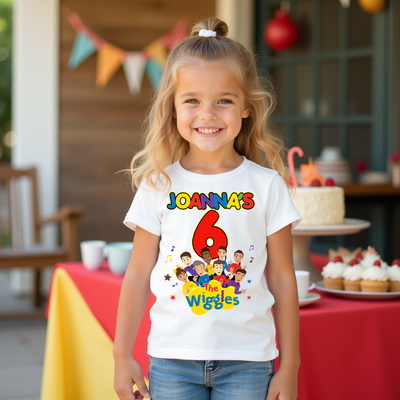 Young girl wearing a 'The Wiggles' themed birthday shirt with colorful graphics.