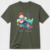 An olive green short-sleeve t-shirt with a colorful graphic of two cartoon superheroes, labeled 'Daddy Nicholas' and 'Father's Day'.