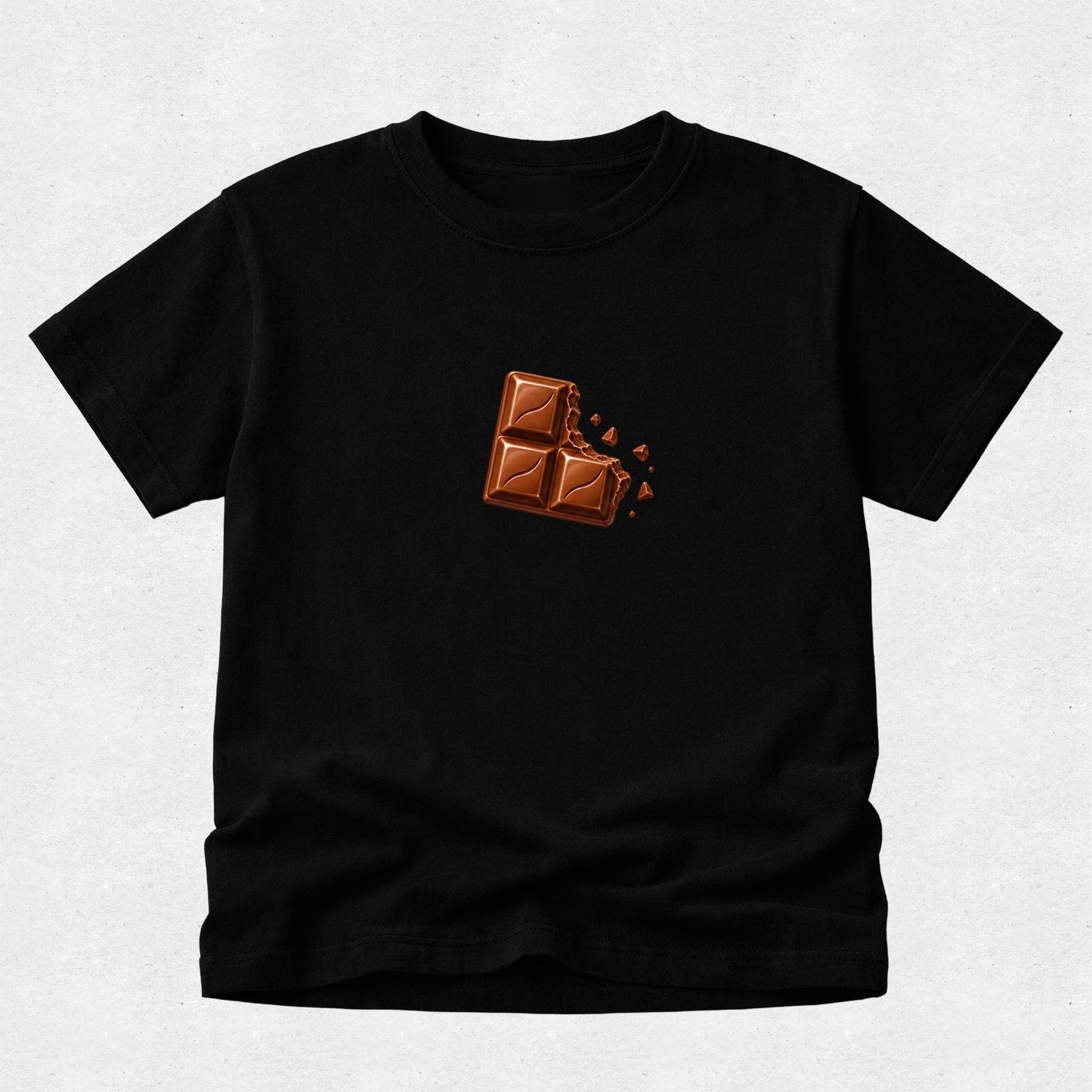 A black short-sleeve crewneck t-shirt featuring a graphic of a broken chocolate bar on the center chest, displayed flat against a light gray textured background.