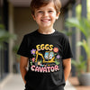 Child wearing a black t-shirt with colorful graphic and text outdoors