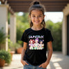 Young girl wearing a black kpop easter t-shirt with colorful graphics and text, standing outdoors.