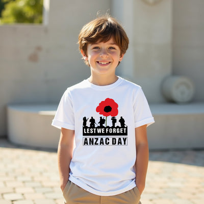 Child wearing a white t-shirt with ANZAC Day design outdoors