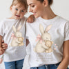 Mother and daughter wearing matching t-shirts with a bunny design on Mother's Day.
