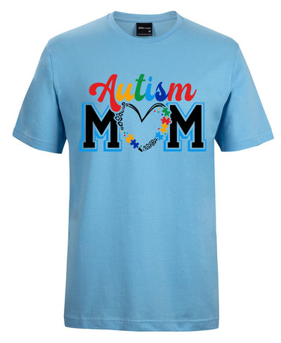 Light blue t-shirt with 'Autism Mom' text and colorful design on a white background