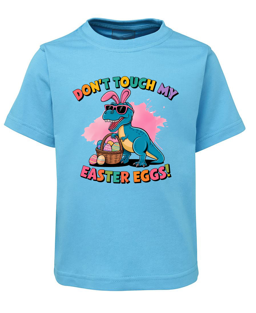 Blue t-shirt with Easter-themed dinosaur graphic and text on a white background
