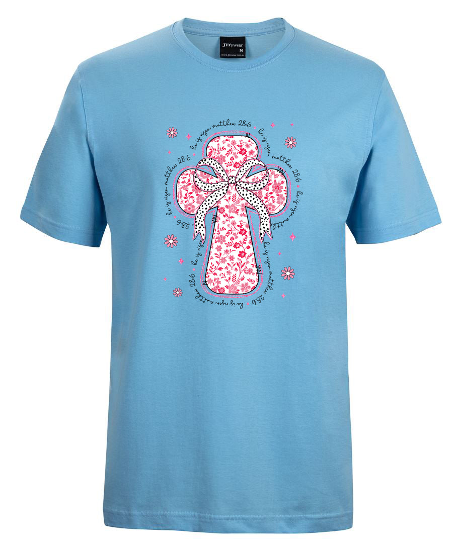 Light blue t-shirt with a pink floral cross design on a white background