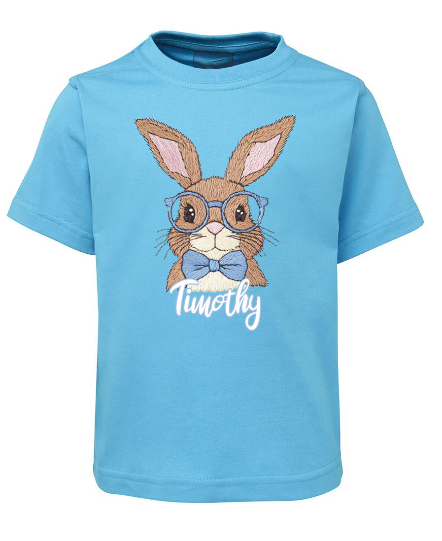 Blue t-shirt with a rabbit graphic and 'Timothy' text on a white background