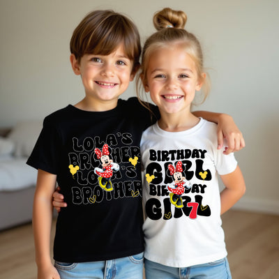 Two children wearing matching shirts with Minnie Mouse designs and text.