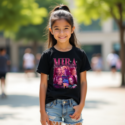 Young girl wearing a black t-shirt with a colorful graphic design outdoors.