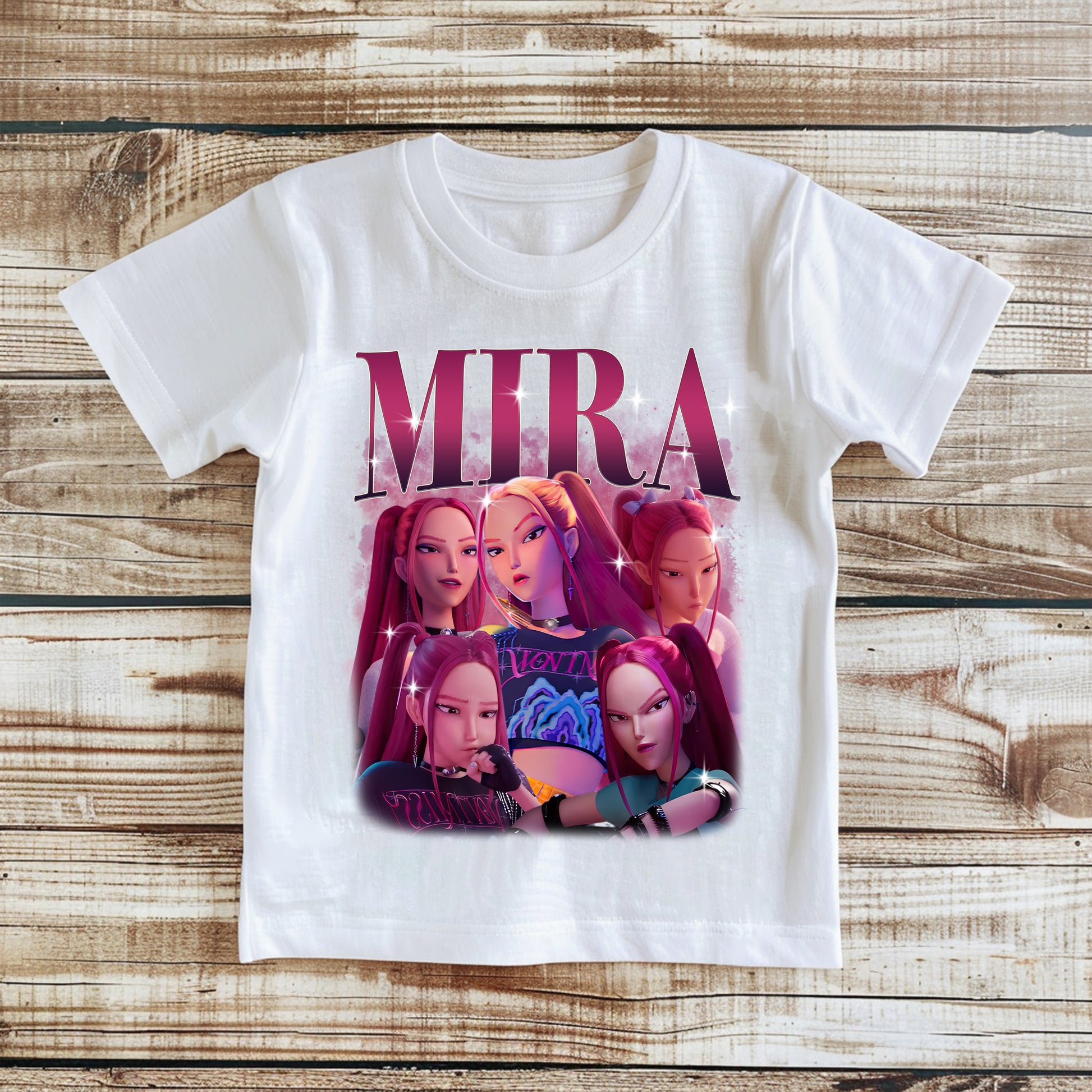 White t-shirt with 'Mira' graphic design on a wooden surface