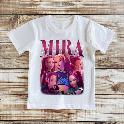 White t-shirt with 'Mira' graphic design on a wooden surface