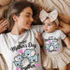 Woman and baby wearing matching 'First Mother's Day Together' shirts with elephant graphics.