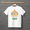 Flat lay of “Nacho Average Dad” t-shirt featuring bold text with nacho and sombrero graphic design.