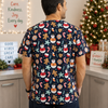 Person wearing a festive scrub top with Christmas-themed designs in a hospital setting.