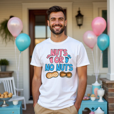 Man wearing a white t-shirt with colorful text and graphics, standing outdoors with balloons in the background.