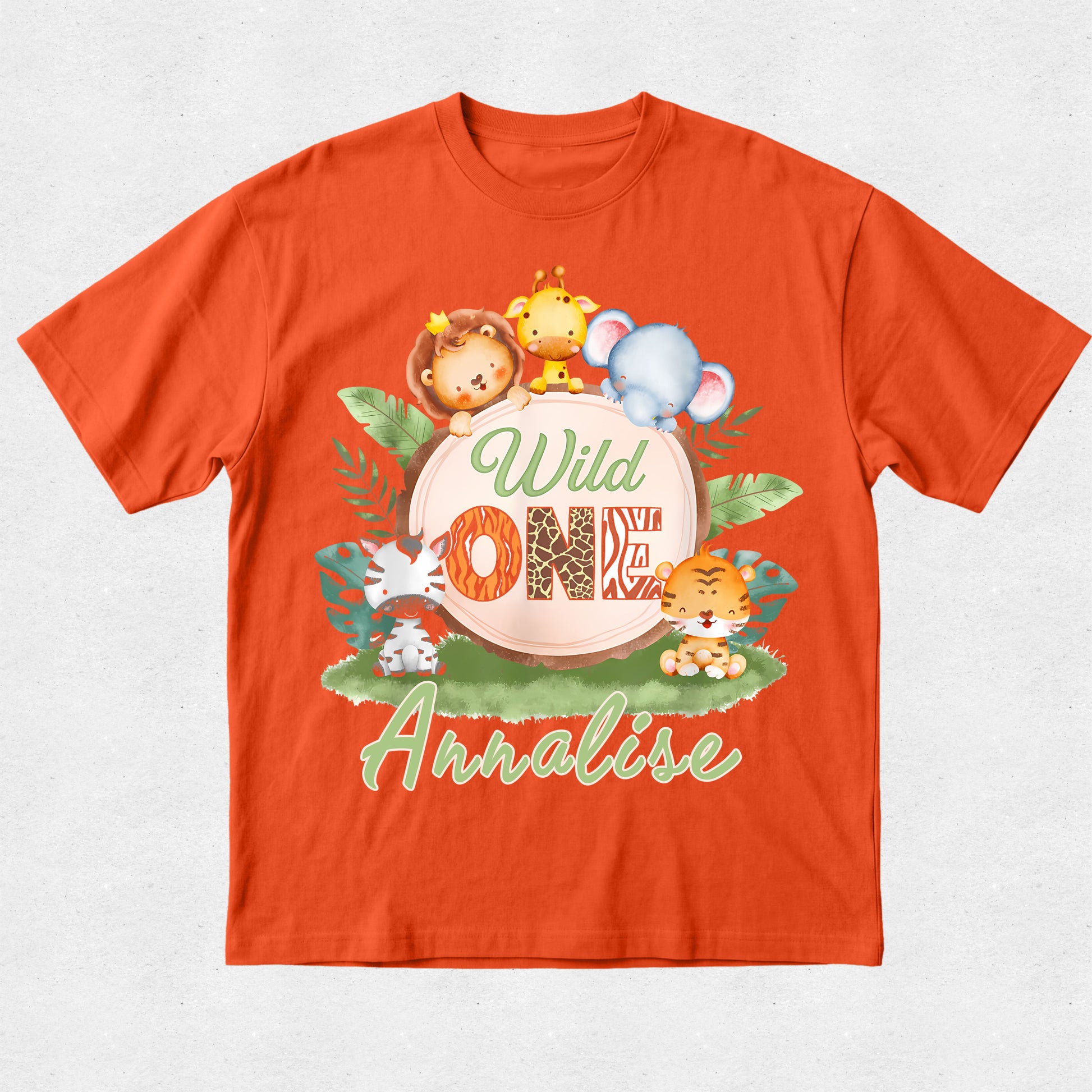 Orange t-shirt with 'Wild One' design featuring cartoon animals on a white background