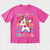 Pink t-shirt with a unicorn graphic and '100 Days of School' text on a light gray background