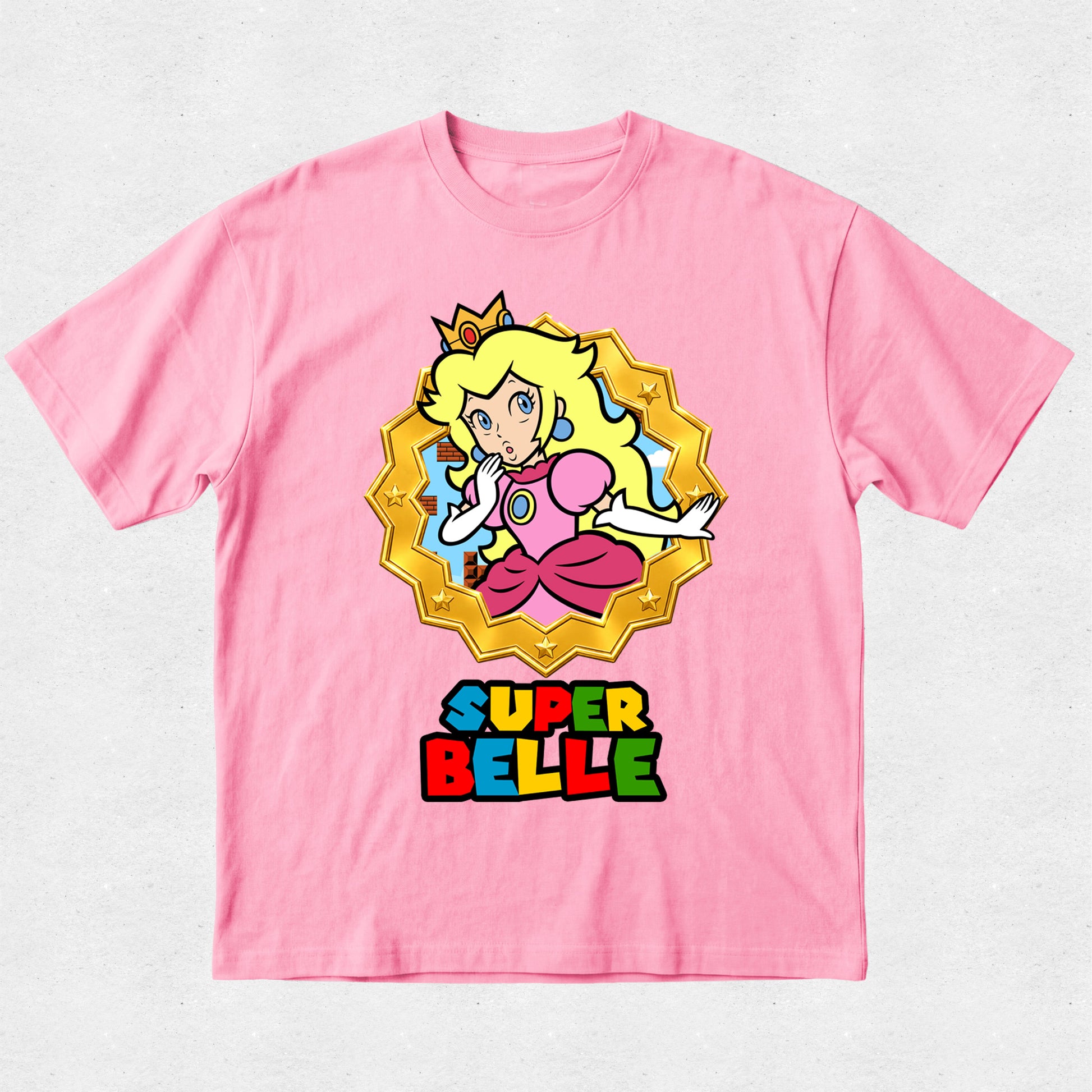 Pink t-shirt with 'Super Belle' graphic design on a white background