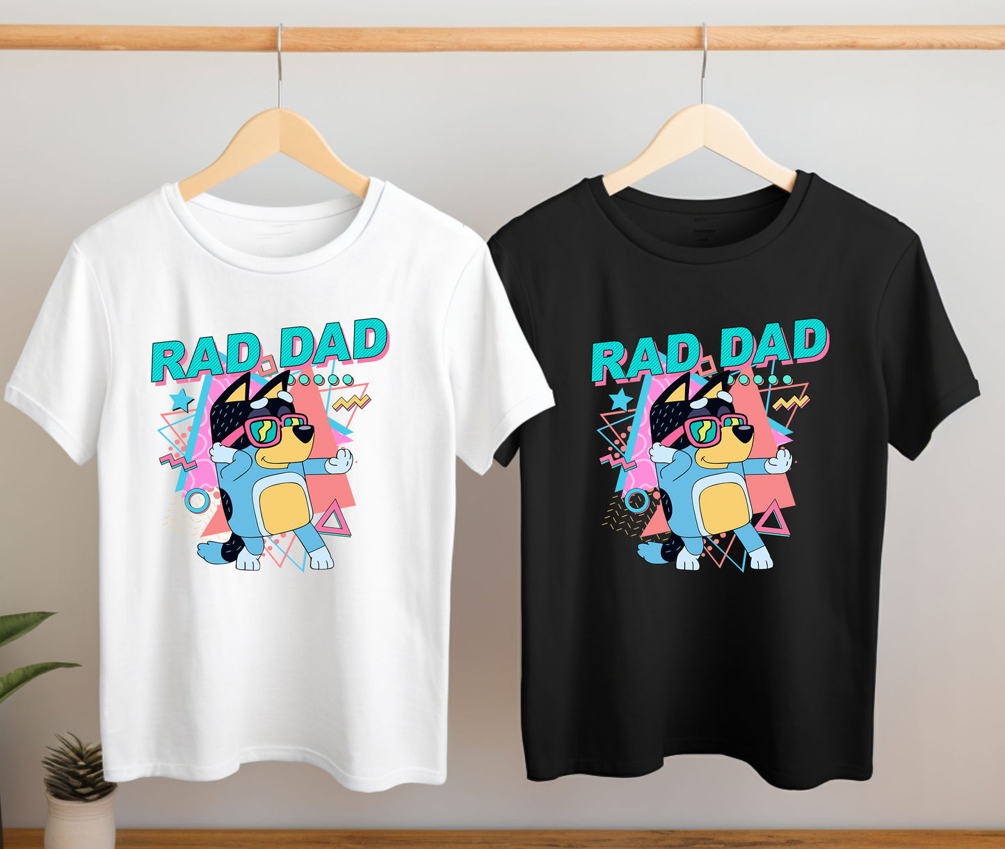 Close-up of Rad Dad Bluey inspired t-shirt design on hanging shirts