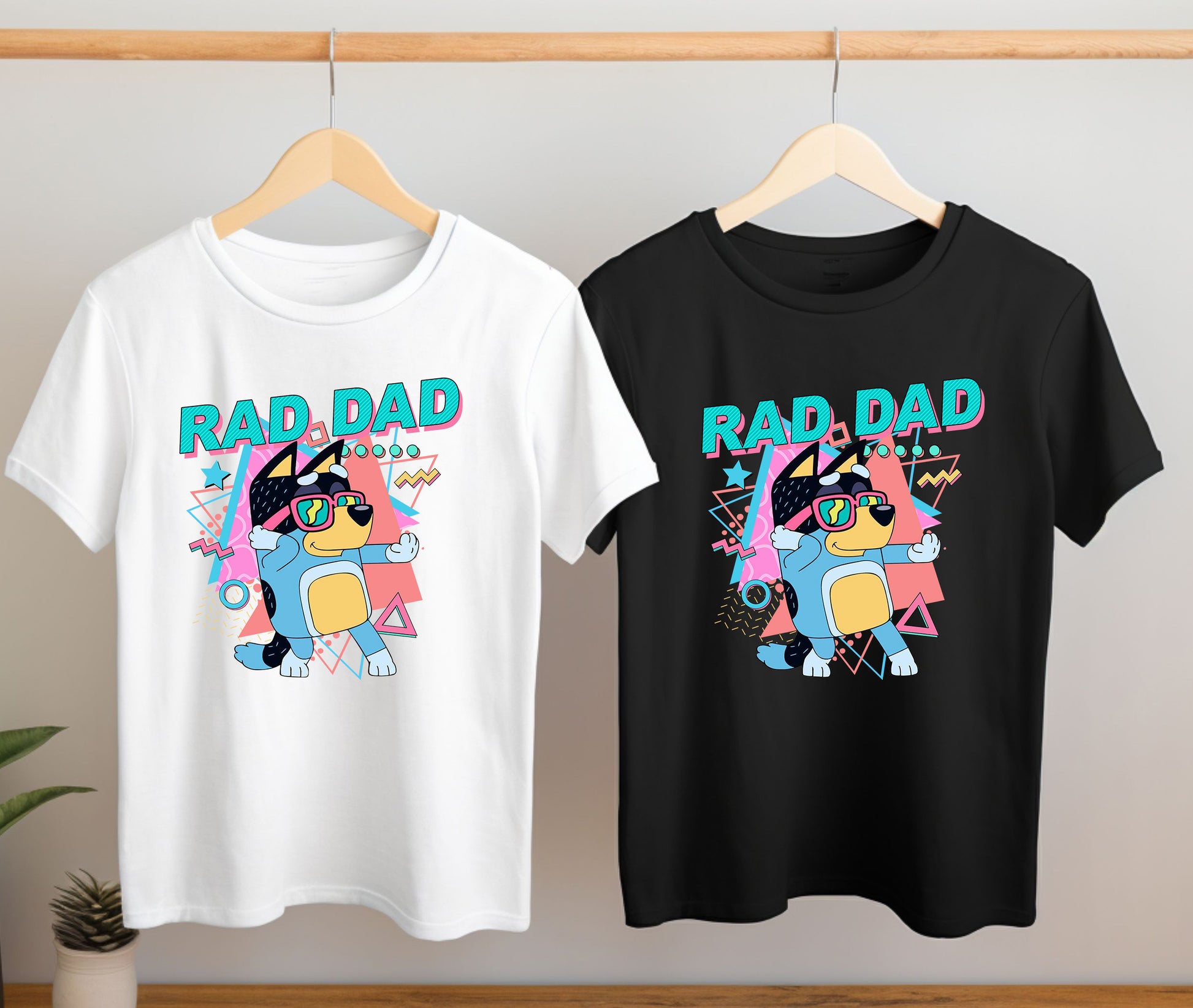 Close-up of Rad Dad Bluey inspired t-shirt design on hanging shirts