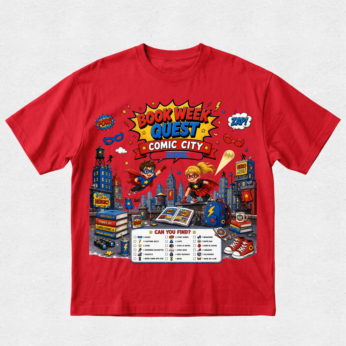 A red short-sleeve crewneck t-shirt featuring a colorful graphic print for 'Book Week Quest Comic City' on a light gray textured background.