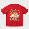 Red t-shirt with cartoon animals and 'Wild One' text on a white background