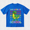 Blue t-shirt with a dinosaur graphic and '100 Days of School' text on a light gray background
