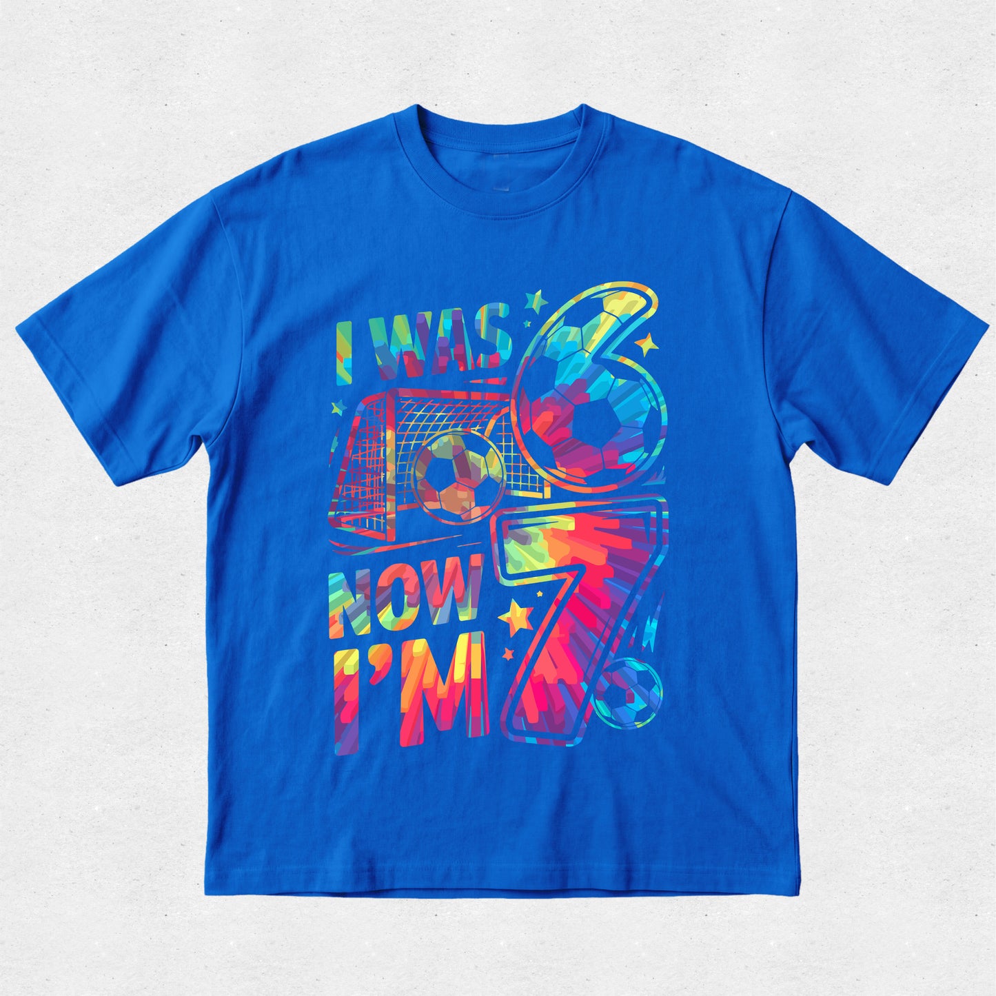 Blue t-shirt with colorful graphic design on a light gray background