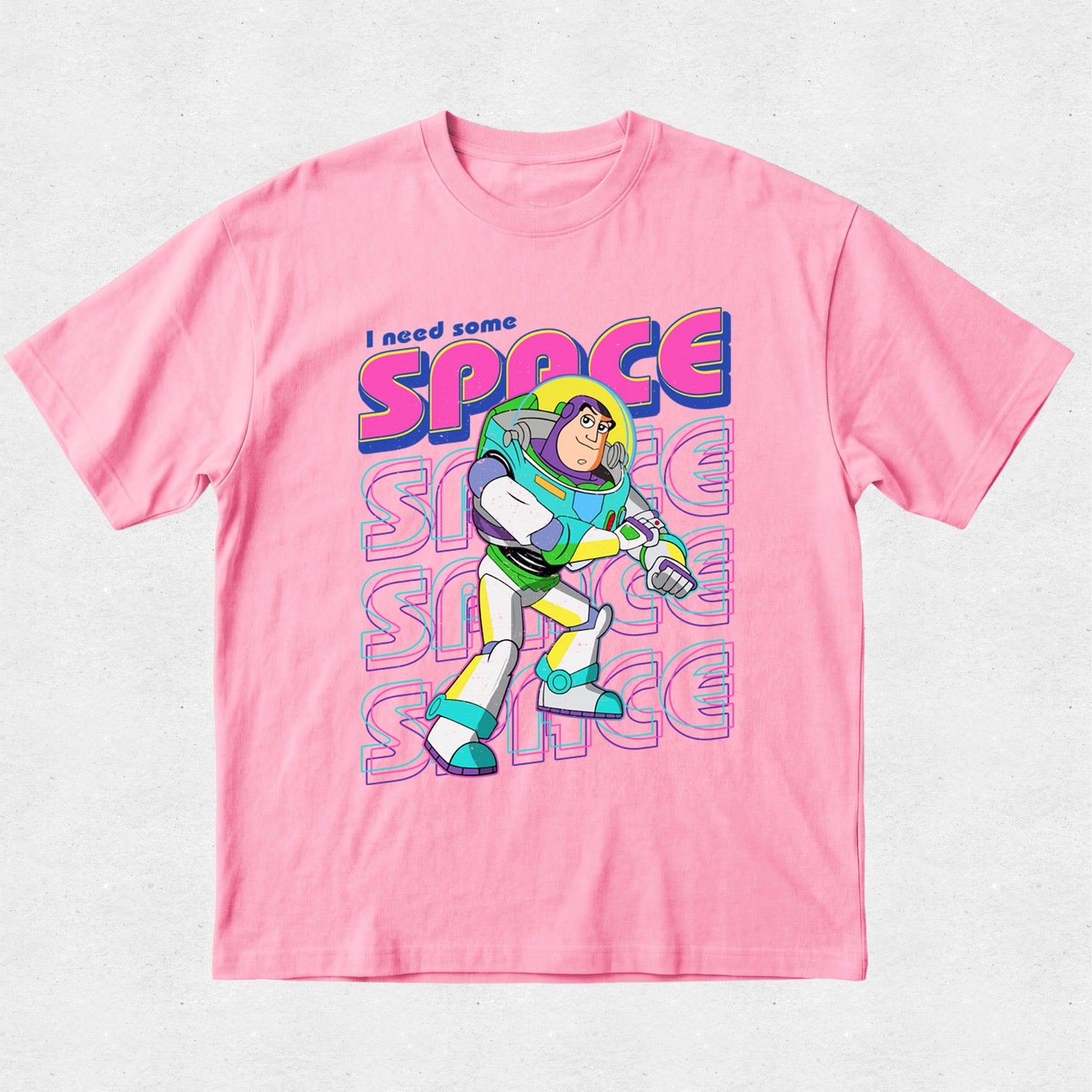 Pink t-shirt with Buzz Lightyear graphic and 'I need some space' text on a light gray background