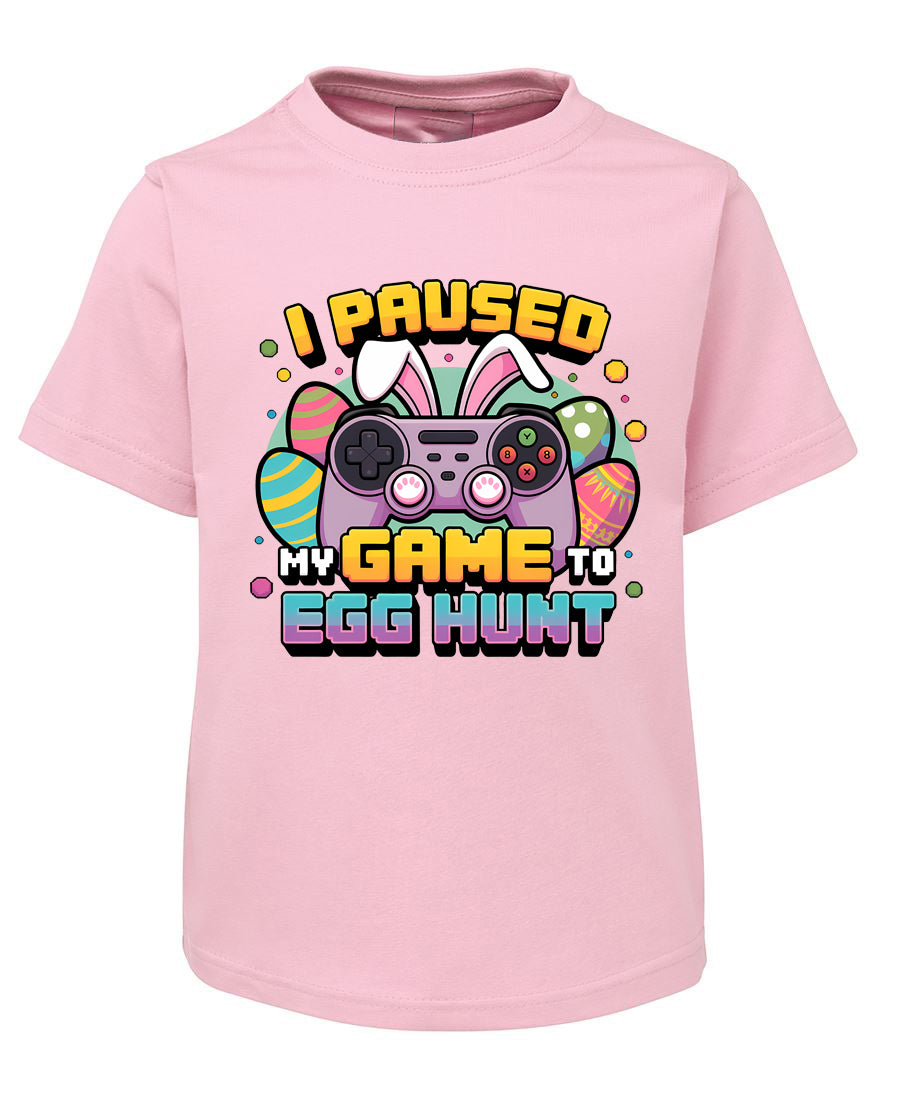 Pink t-shirt with Easter graphic and text on a white background