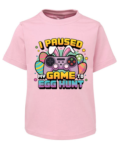 Pink t-shirt with Easter graphic and text on a white background