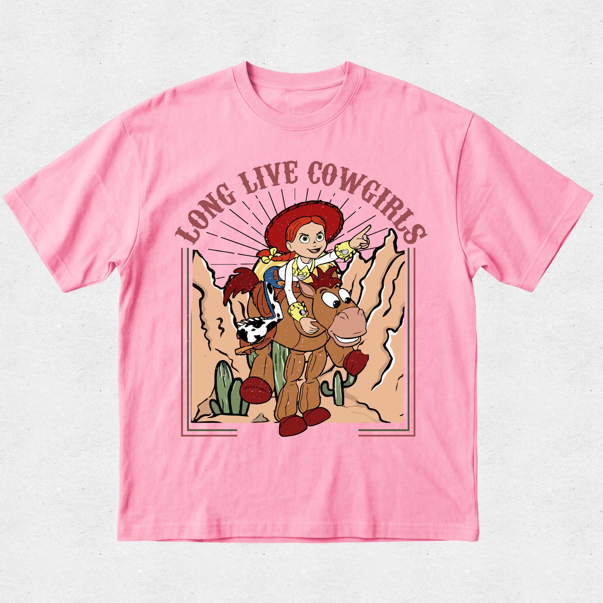Pink t-shirt with a graphic of a cowgirl and horse, featuring the text 'Long Live Cowgirls'.