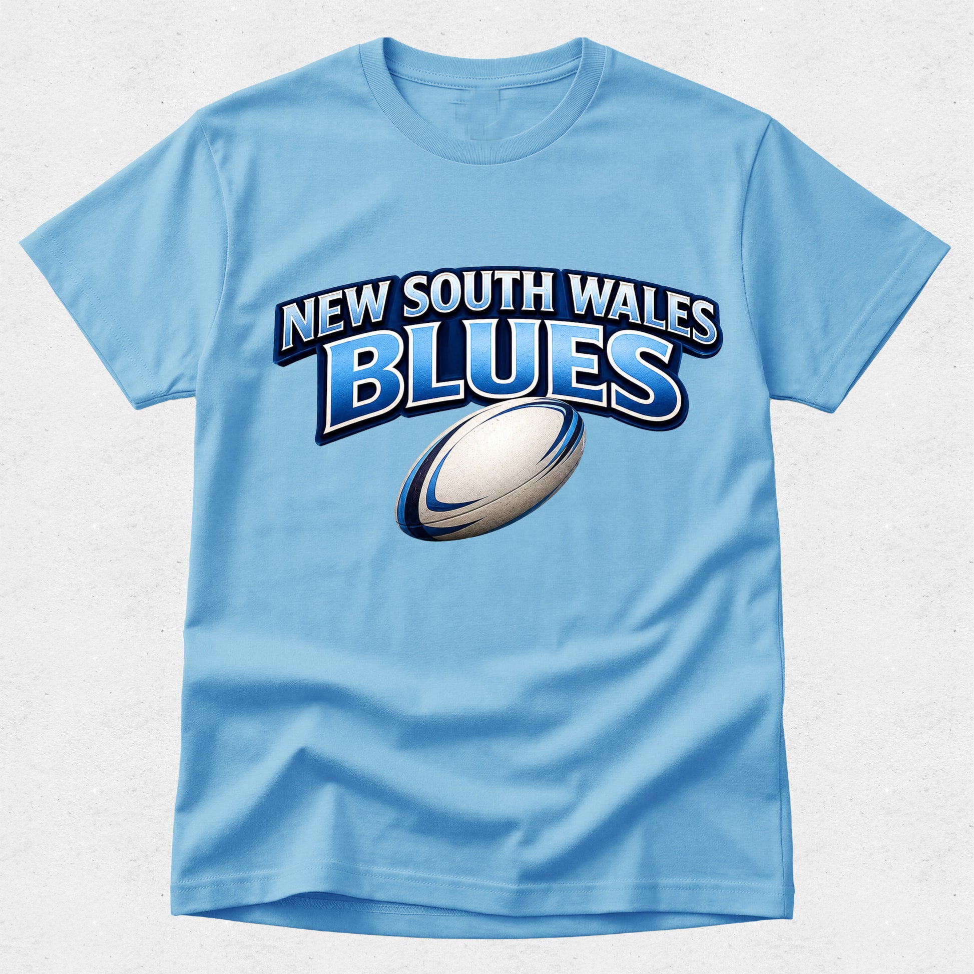Light blue t-shirt with 'New South Wales Blues' text and rugby ball graphic on a light gray background
