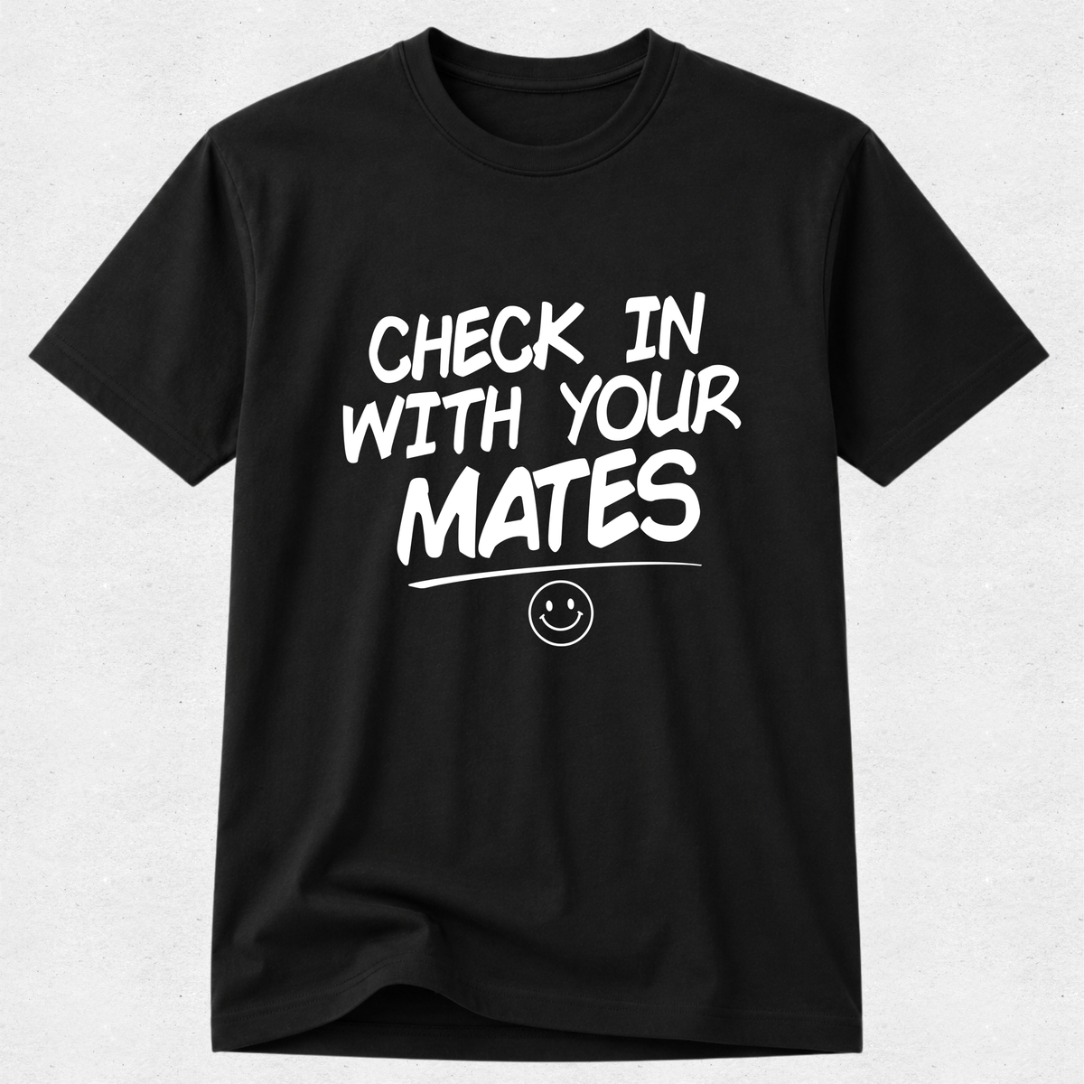 A black short-sleeve crewneck t-shirt with the phrase 'CHECK IN WITH YOUR MATES' printed in white across the chest, accompanied by a small smiley face graphic underneath.