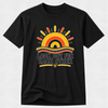 A black short-sleeve crewneck t-shirt with a retro sunset graphic and the text 'LOOK OUT FOR EACH OTHER' printed on the chest, displayed against a light gray textured background.