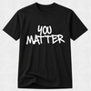 A black short-sleeve crewneck t-shirt with the phrase 'YOU MATTER' printed in a white, hand-drawn brush-style font across the chest, displayed against a light gray textured background.