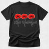 Black t-shirt with red poppies and 'Lest We Forget' text on a white background