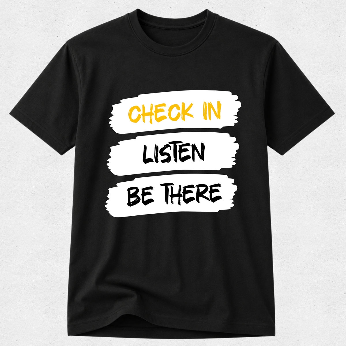 A black short-sleeve crewneck t-shirt with a graphic print on the front. The graphic consists of three white brushstroke blocks containing the text 'CHECK IN', 'LISTEN', and 'BE THERE' in yellow, black, and white lettering, respectively.