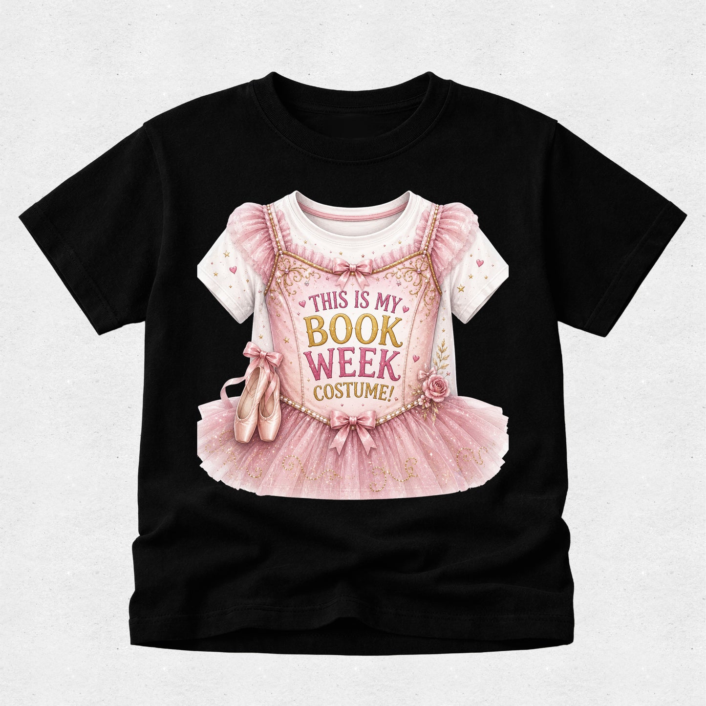 A black short-sleeve t-shirt with a graphic of a pink ballet costume and the text 'THIS IS MY BOOK WEEK COSTUME!' printed on the front, displayed against a light gray background.
