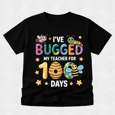 A black short-sleeve t-shirt with a colorful graphic design celebrating a teacher's 100th day, featuring cartoon bees, a beehive, stars, and the text 'I'VE BUGGED MY TEACHER FOR 100 DAYS'.